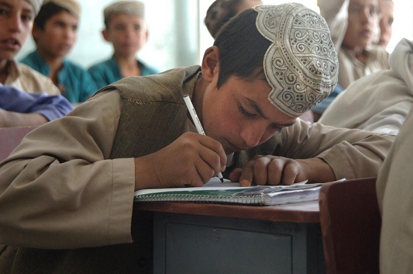 An_Afghan_student_takes_copious_notes